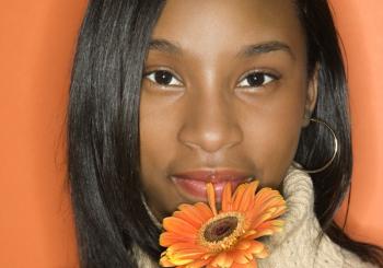 black teen girl with daisy happy